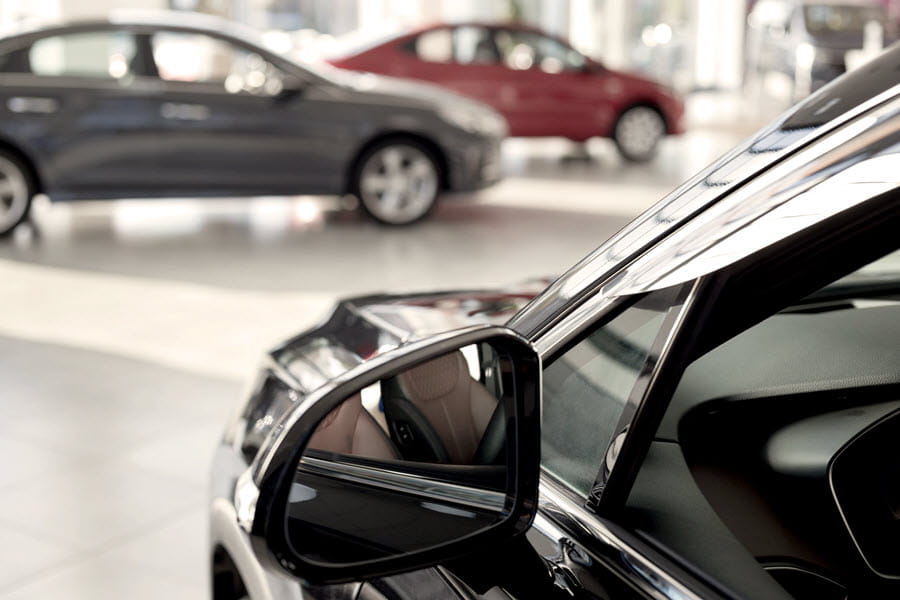 Cars on display in a car retailer showroom.