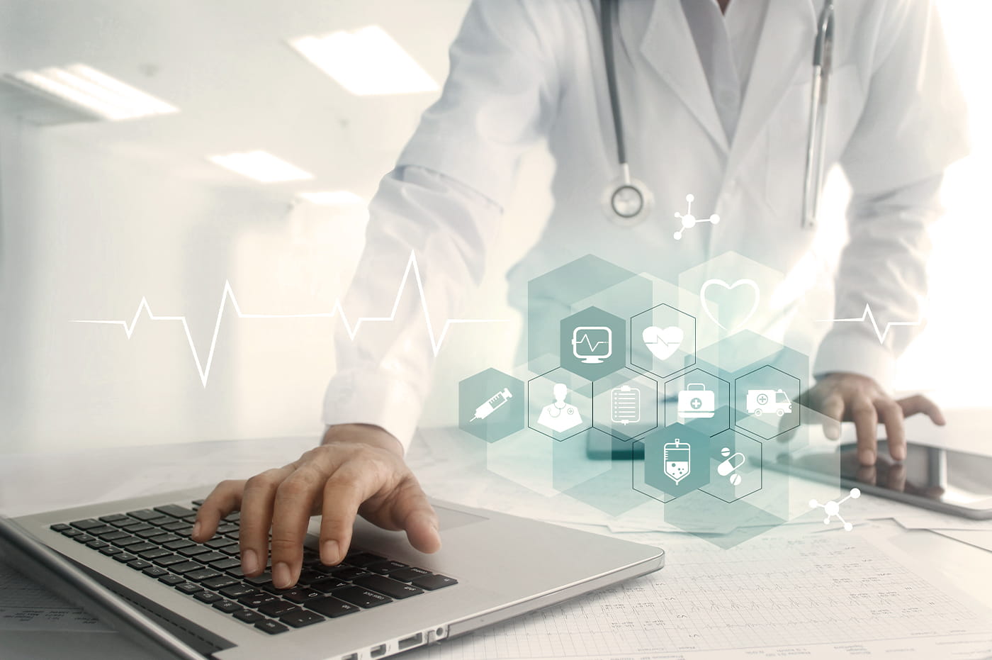 Doctor working on a laptop with health symbols floating above it 
