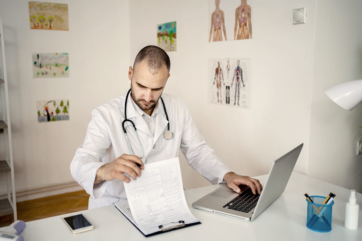 A doctor reviewing paperwork.