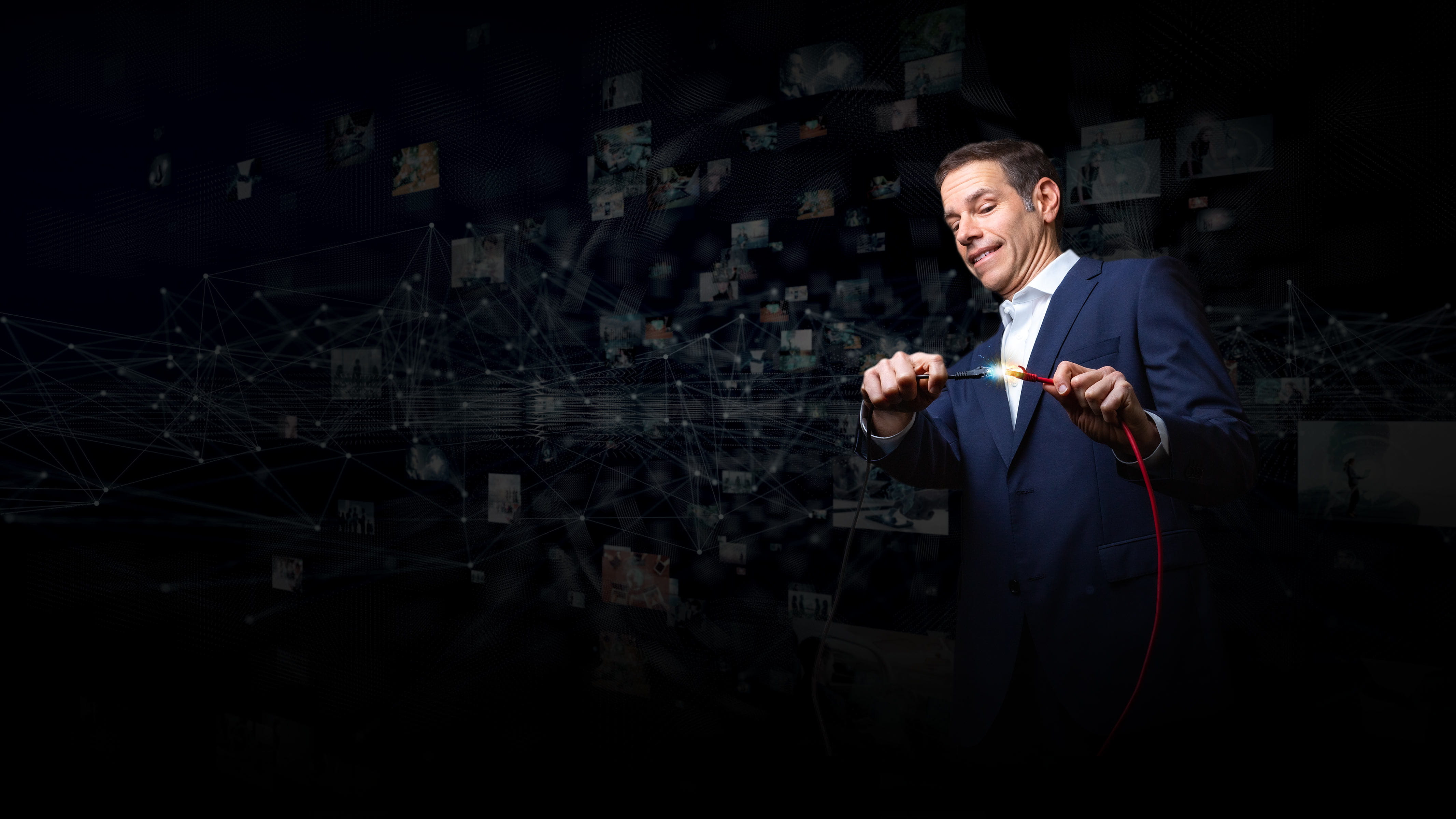 Michael Zucker, VP, IT, connecting wires with sparks