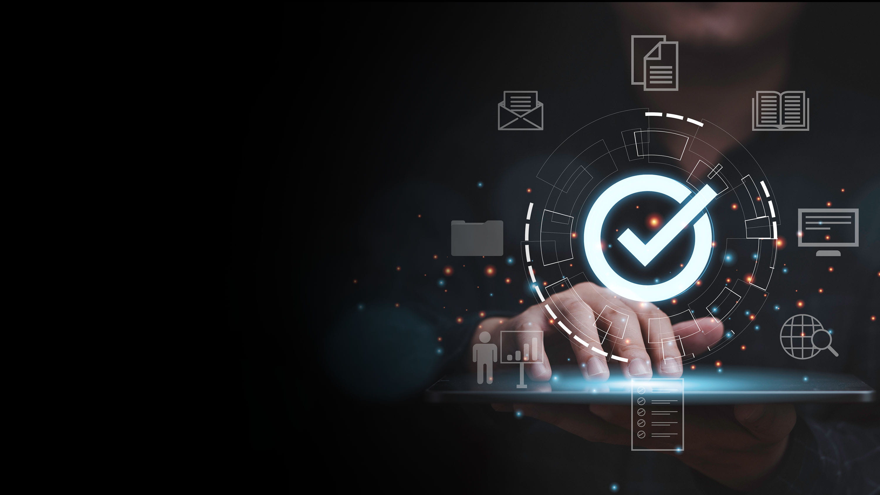 A man using a tablet and holographic symbols floating around his hand.