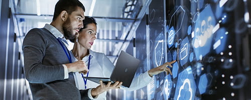 Two IT workers collaborating