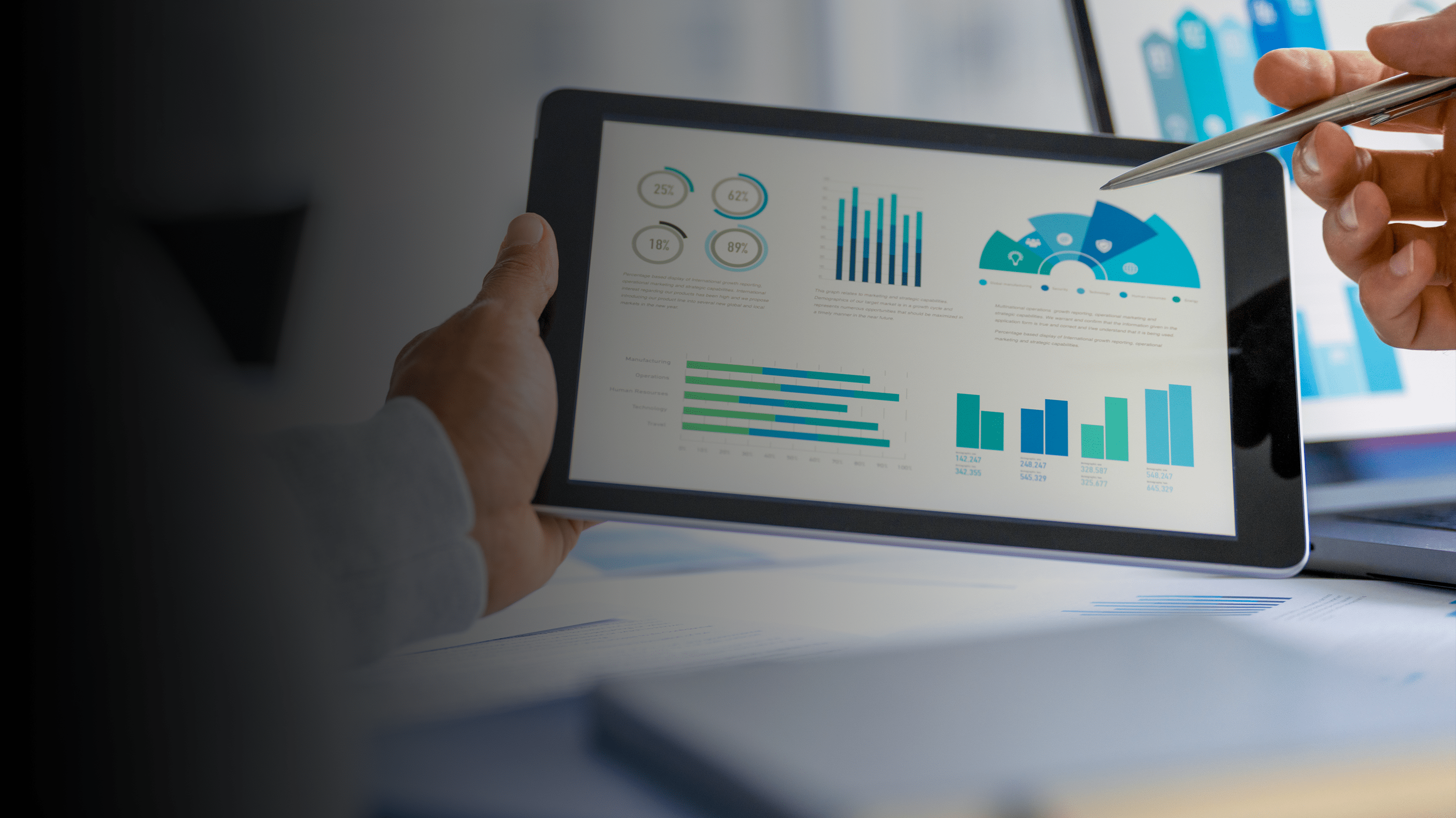 Tablet with data, charts, tables, graphs.