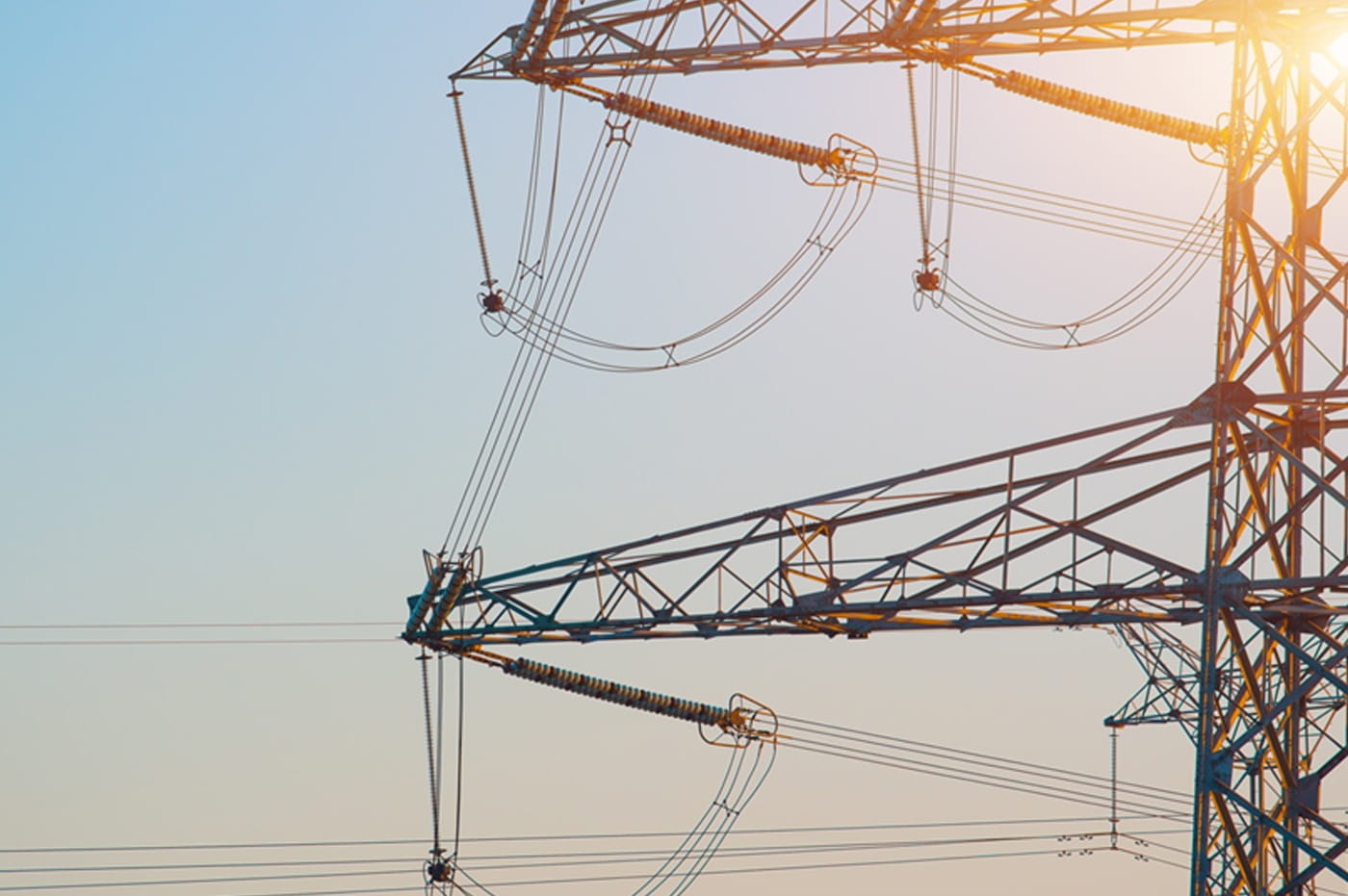 Energy lines and energy tower in the sunlight.